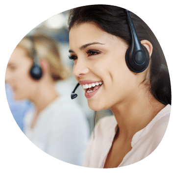 a woman wearing a headset smiling in a call center